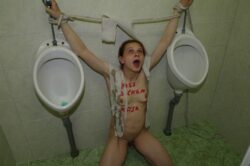 Nude German submissive woman Katja tied to urinals