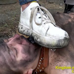 Submissive girl in collar covered with dirt licks a Mistress's dirty sneaker